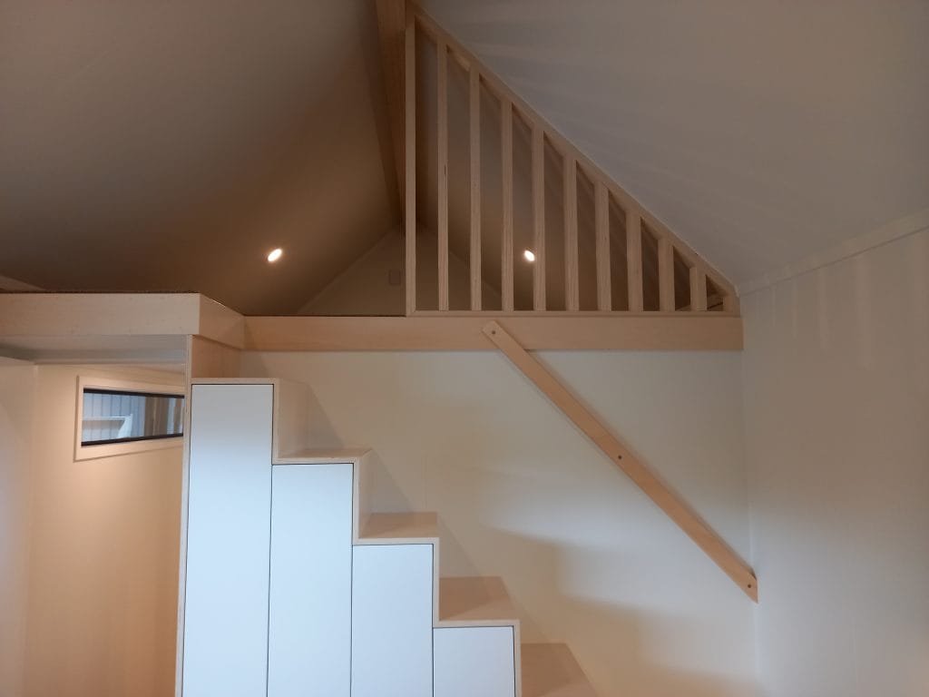 The Everest XL - 1Bedroom showing storage staircase and mezzanine level above