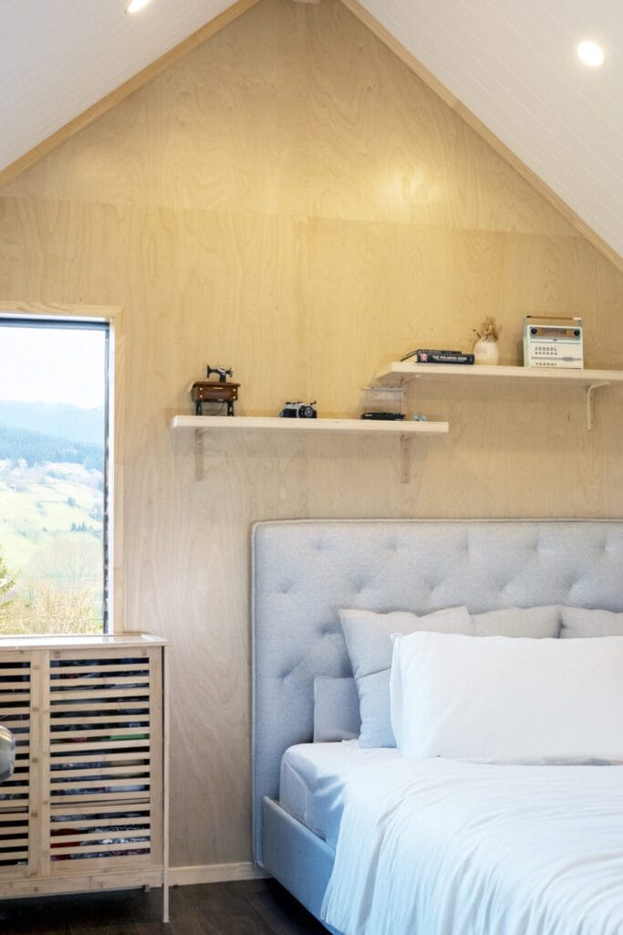 Everest XL 2 Bedroom Tiny Home by Fox Cabins with deck built onsite by client.